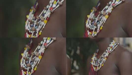 非洲坦桑尼亚色非洲马赛人穿传统服装跳舞唱歌彩斑斓的珠饰项链特写高清在线视频素材下载