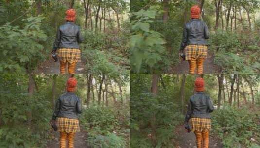 林中漫步的女人背影高清在线视频素材下载