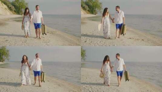 恩爱的夫妇正沿着热带海滩散步高清在线视频素材下载