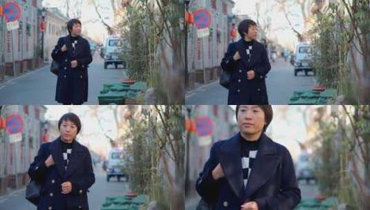 冬季走在北京古老胡同的东方女性高清在线视频素材下载