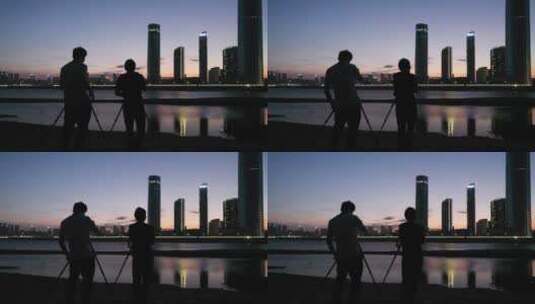 摄影师们拍摄城市风光夜景高清在线视频素材下载