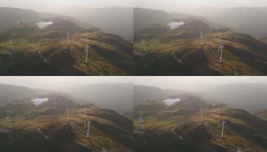 航拍夕阳下山顶风力发电机高清在线视频素材下载