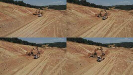 挖掘机挖土填充自卸车高清在线视频素材下载