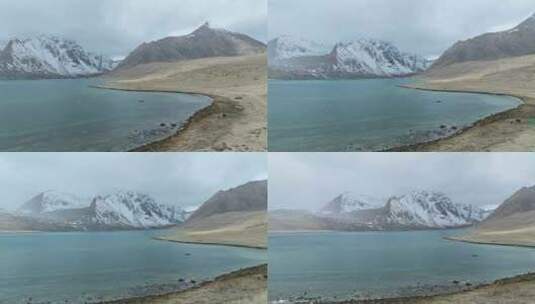 航拍西藏日喀则定结宗措湖和阿玛直米雪山高清在线视频素材下载