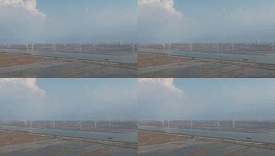 大海海边沙滩风力发电风车航拍高清在线视频素材下载