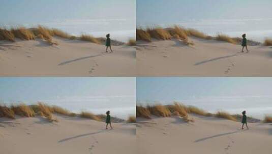 无名女孩行走沙漠在沙滩上留下脚印高清在线视频素材下载