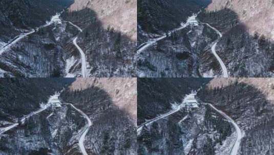 四川雅安冬季下雪林间山谷蜿蜒的盘山公路高清在线视频素材下载