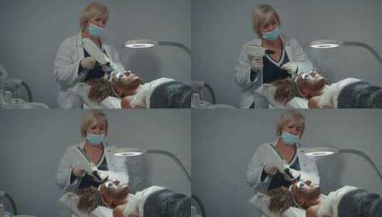 美容师在美容院做脱皮手术医生检查面部皮肤高清在线视频素材下载