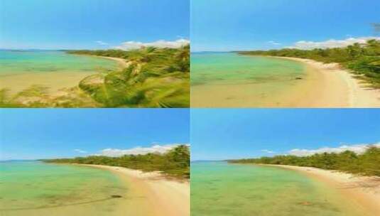 天堂岛上椰子树阳光海滩的动态镜头高清在线视频素材下载