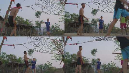 老挝农村的孩子们在踢球高清在线视频素材下载