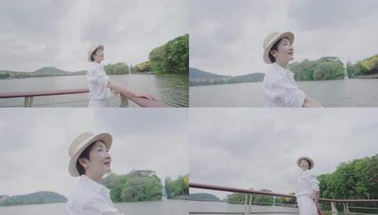 知性优雅女人湖面栈桥上展望未来享受宁静高清在线视频素材下载