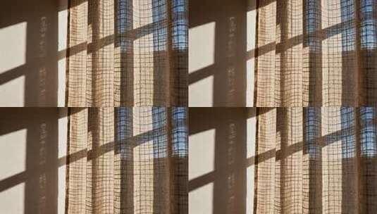 阳光透过窗帘洒在墙面高清在线视频素材下载