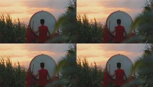 夕阳下击鼓表演 五谷丰登 田地里打鼓高清在线视频素材下载