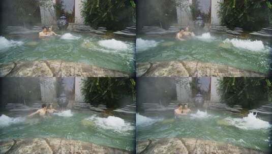 情侣在温泉中享受宁静时光高清在线视频素材下载