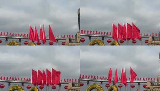 城市建筑前飘扬的红色旗帜高清在线视频素材下载