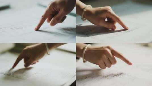 手指指点图纸画面高清在线视频素材下载