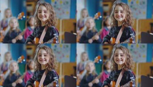 快乐女孩教室里弹奏尤克里里微笑高清在线视频素材下载