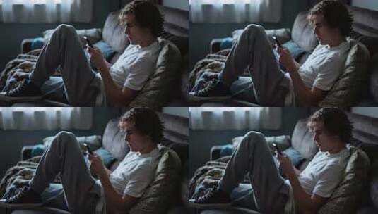 男子沙发上玩手机素材高清在线视频素材下载