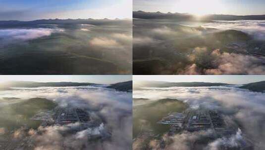 云雾缭绕的山间城市日出云海高清在线视频素材下载