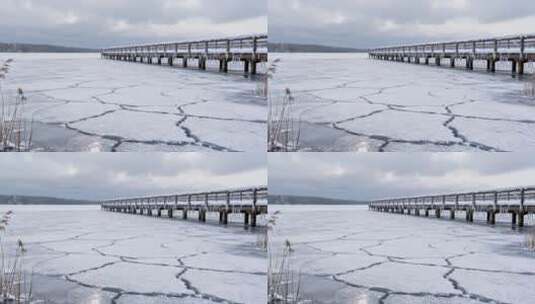 冬日结冰湖面与栈桥景观高清在线视频素材下载