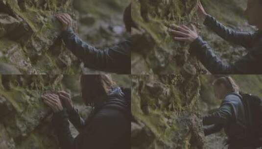 女人触摸长满苔藓的岩石视频高清在线视频素材下载