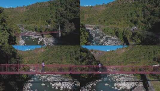 4k云南风光视频腾大山河谷间的吊桥女游客高清在线视频素材下载