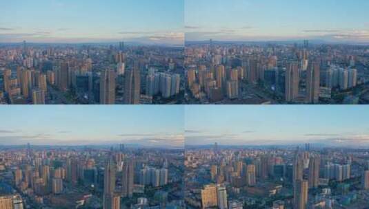 太阳日落时的昆明城顺光航拍高清在线视频素材下载