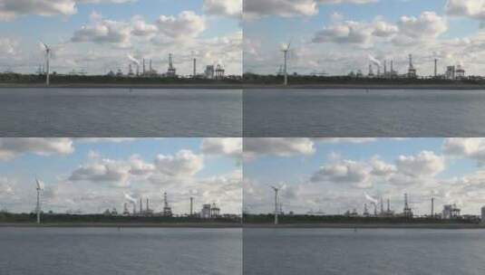 现代风车和炼油厂景观高清在线视频素材下载