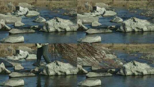 背树枝过河的人砍柴人过河高清在线视频素材下载