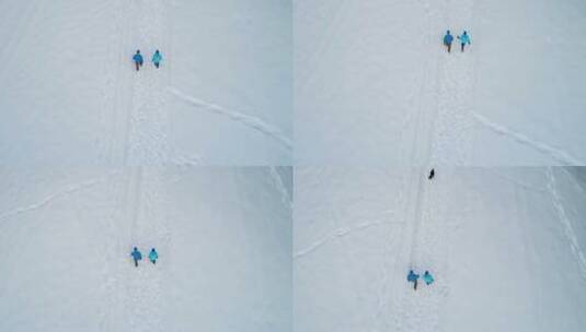 航拍人在雪地中行走高清在线视频素材下载