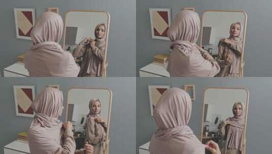 照镜子的穆斯林妇女高清在线视频素材下载