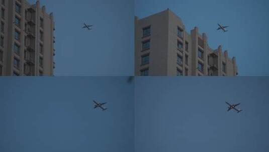 飞机飞过城市上空高清在线视频素材下载