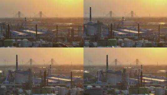 航拍城市日落时的风力新能源和石化工厂高清在线视频素材下载