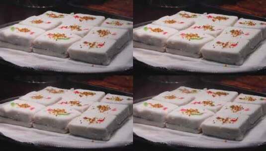 热气腾腾的中国传统风味特色糕点小吃桂花糕高清在线视频素材下载