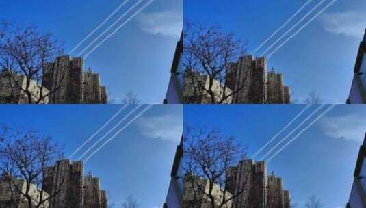 划过蓝天的飞机尾迹云高清在线视频素材下载