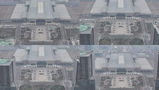 郑州东站铁轨城市车流高楼大厦双子塔下降高清在线视频素材下载