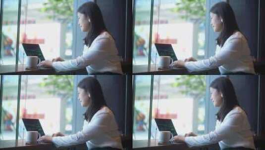 商务女性在办公室使用笔记本电脑办公高清在线视频素材下载