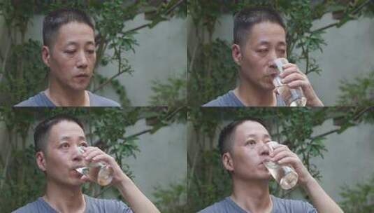 户外男子院子里喝水特写画面高清在线视频素材下载