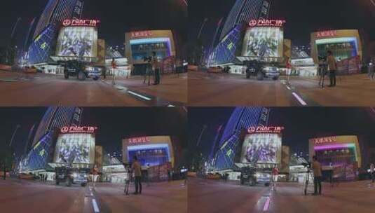 电视新闻记者夜晚在城市街头做直播报道高清在线视频素材下载