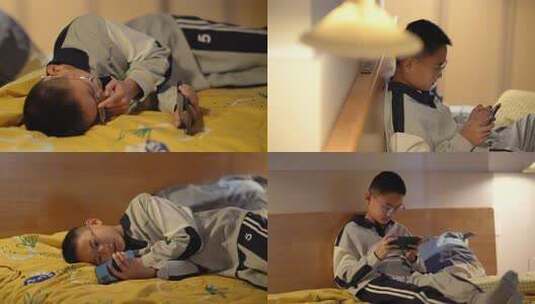 孩子夜晚玩手机打游戏高清在线视频素材下载