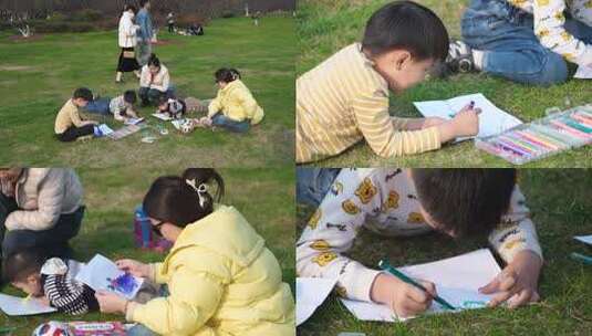4K孩子在妈妈的陪同下在草坪上画画高清在线视频素材下载