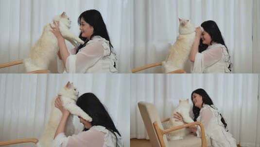 女孩在落地窗边抱着猫咪玩耍高清在线视频素材下载