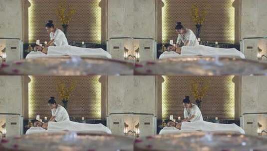 女人在豪华温泉酒店享受放松按摩spa高清在线视频素材下载