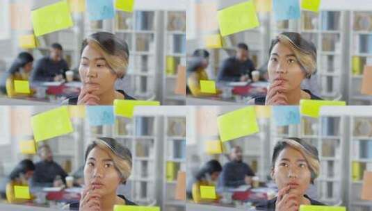 体贴的亚洲女人看着备忘录高清在线视频素材下载
