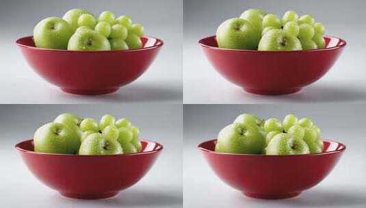 红碗中晶莹剔透的青苹果与葡萄高清在线视频素材下载