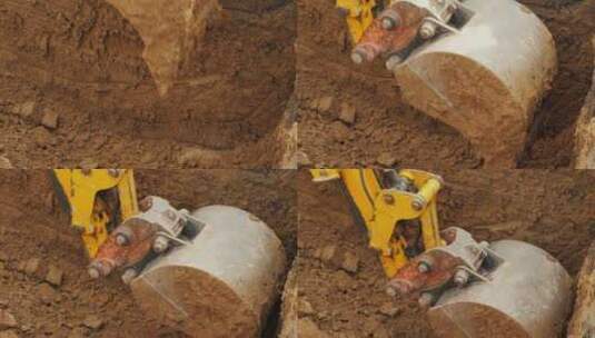 挖掘机的铲斗清除土壤高清在线视频素材下载