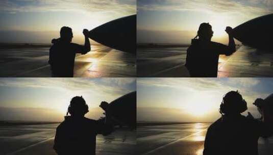 日落时分人们蹲在飞机前高清在线视频素材下载