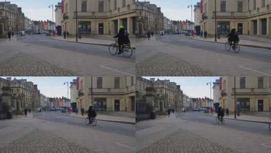 平移镜头拍摄老街骑自行车的人高清在线视频素材下载