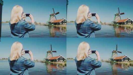 女人拍荷兰风车的照片高清在线视频素材下载
