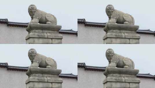 中式建筑前的石狮雕像高清在线视频素材下载